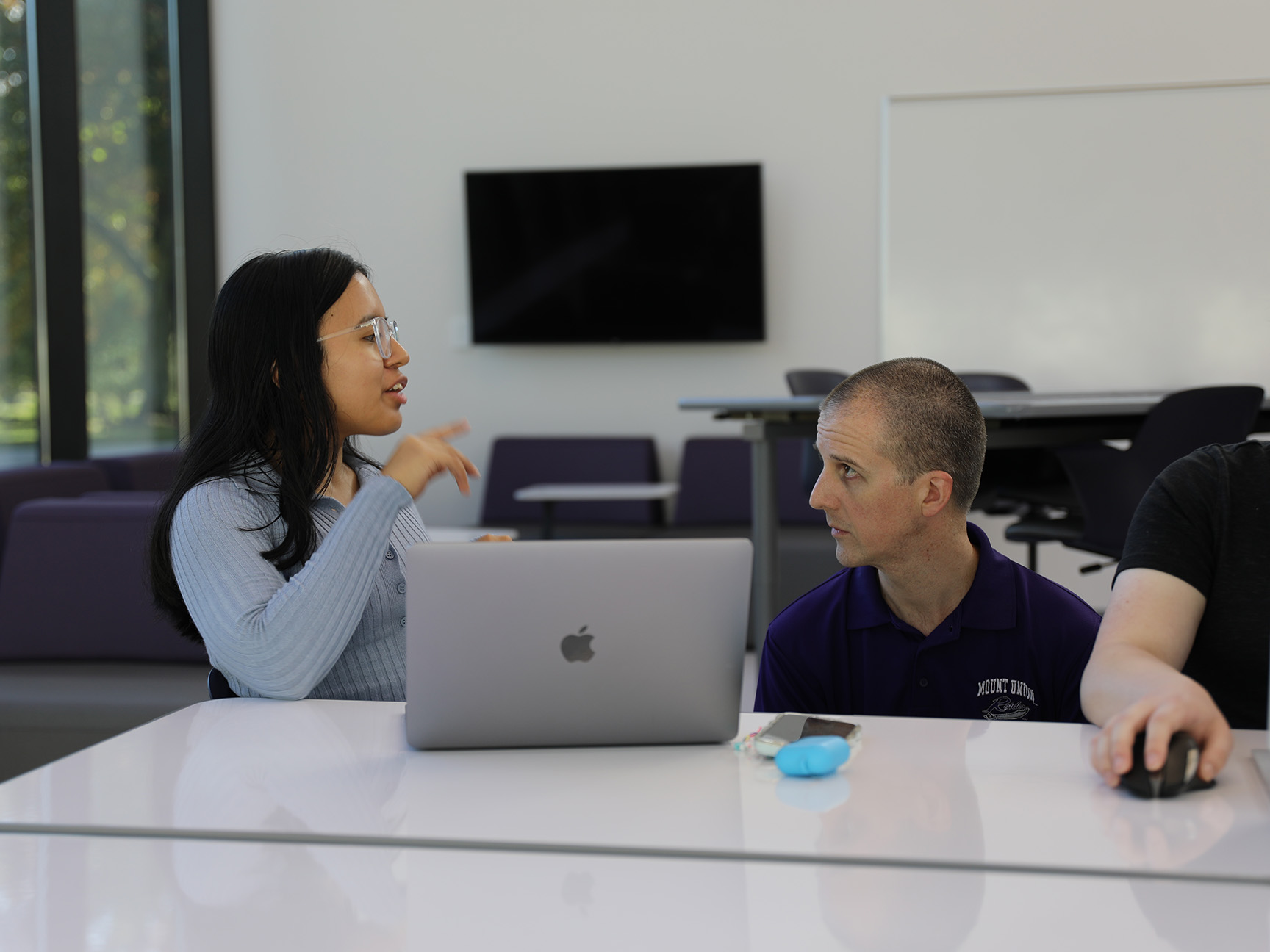 A student and professor in a data science class