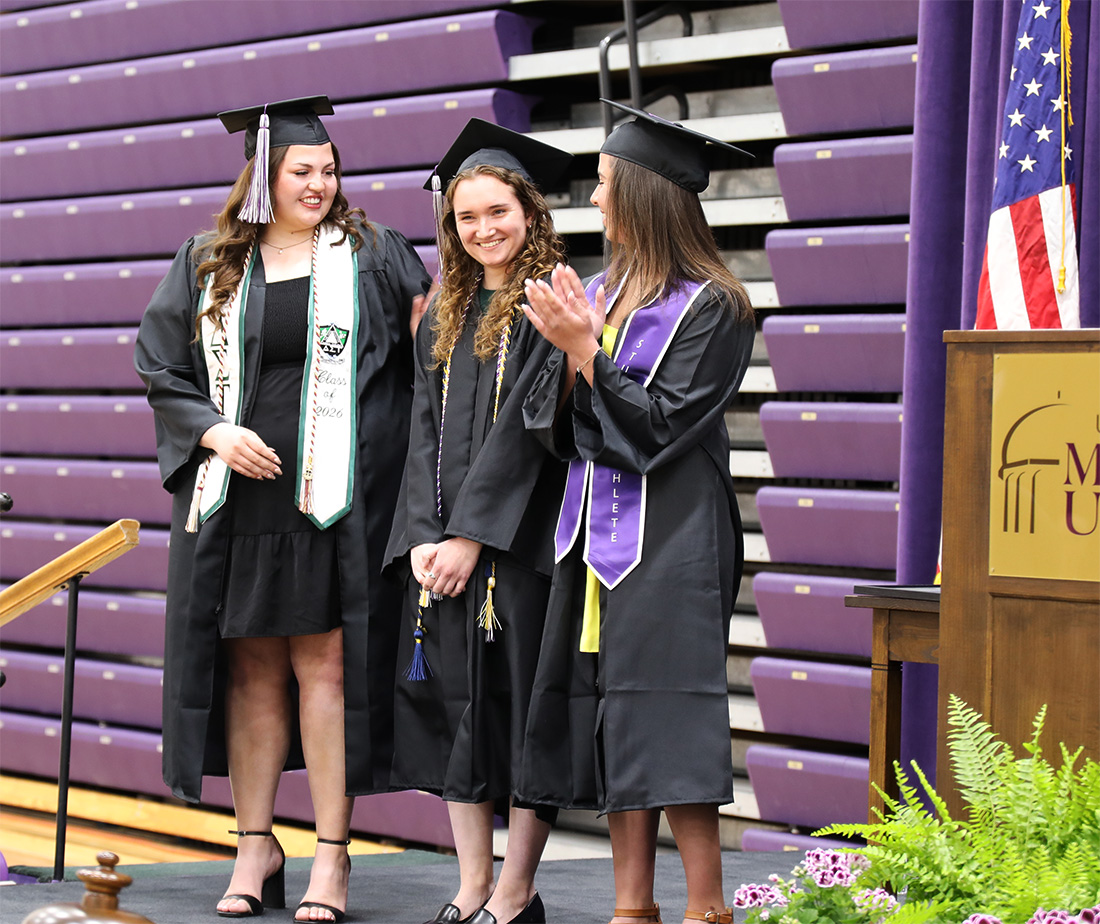 Group of women standing on stage