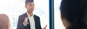 man presenting in conference room