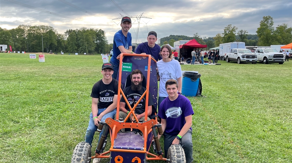 Mount Union's BAJA Racing Team posing around car