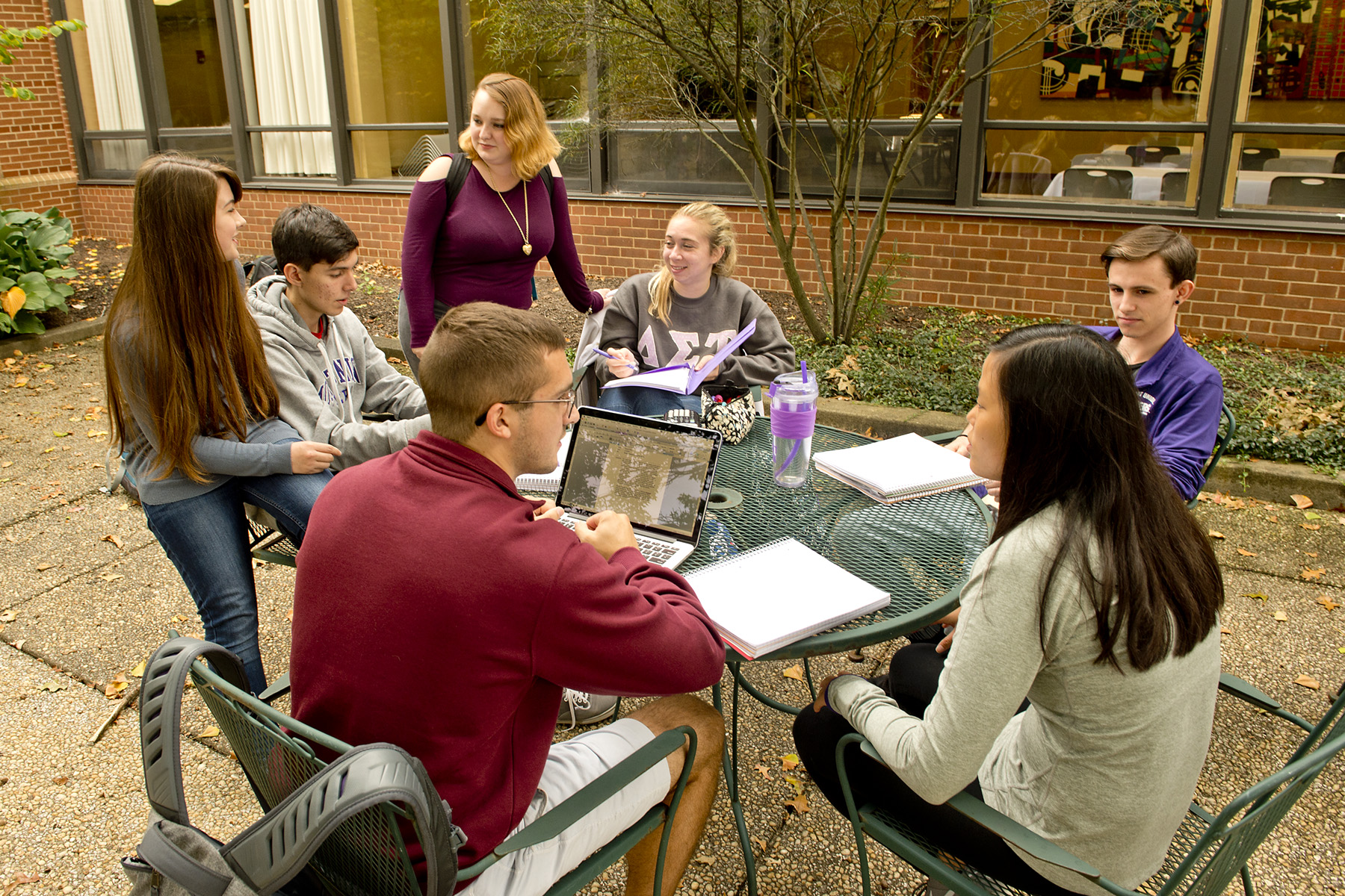 Students gathered in courtyard talking