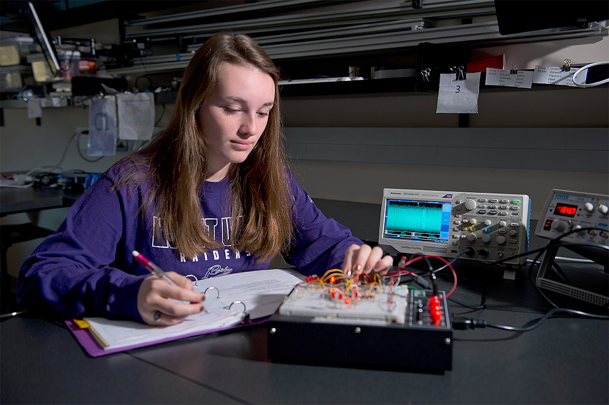Student using electrical equipment 