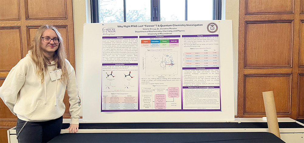 stroup standing with posterboard