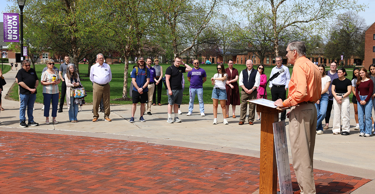 Kachilla speaking to audience in attendance at event