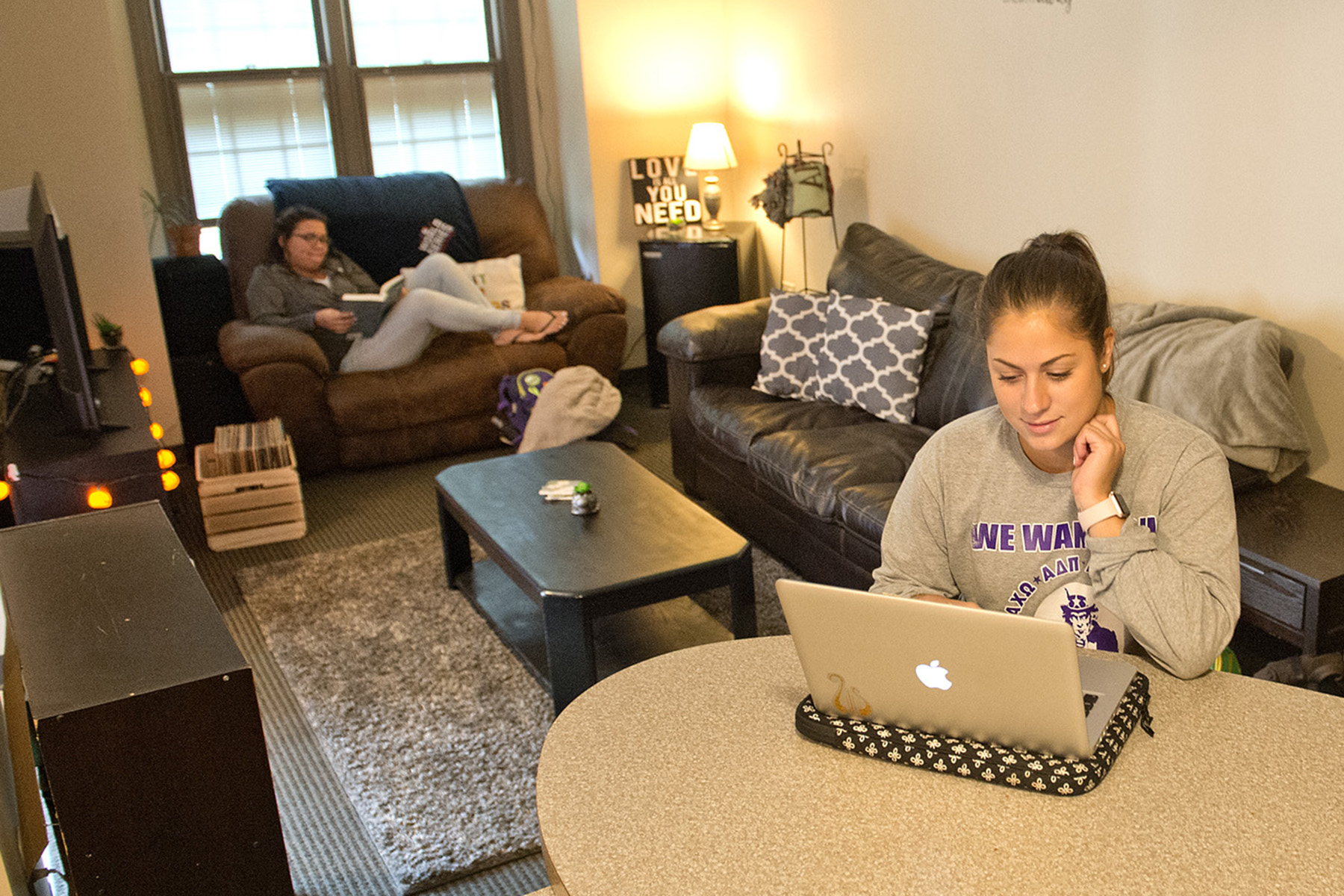 students sitting in suite housing