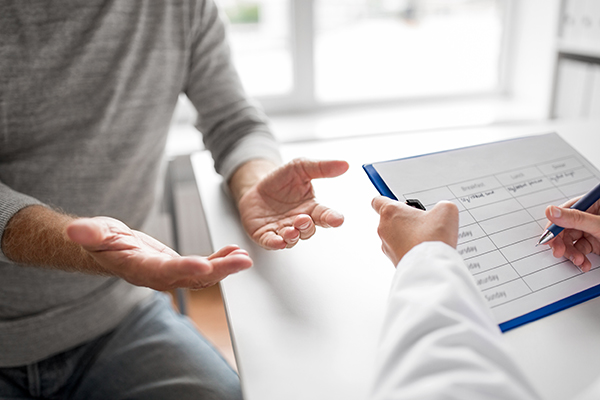 Two individuals discussing a report