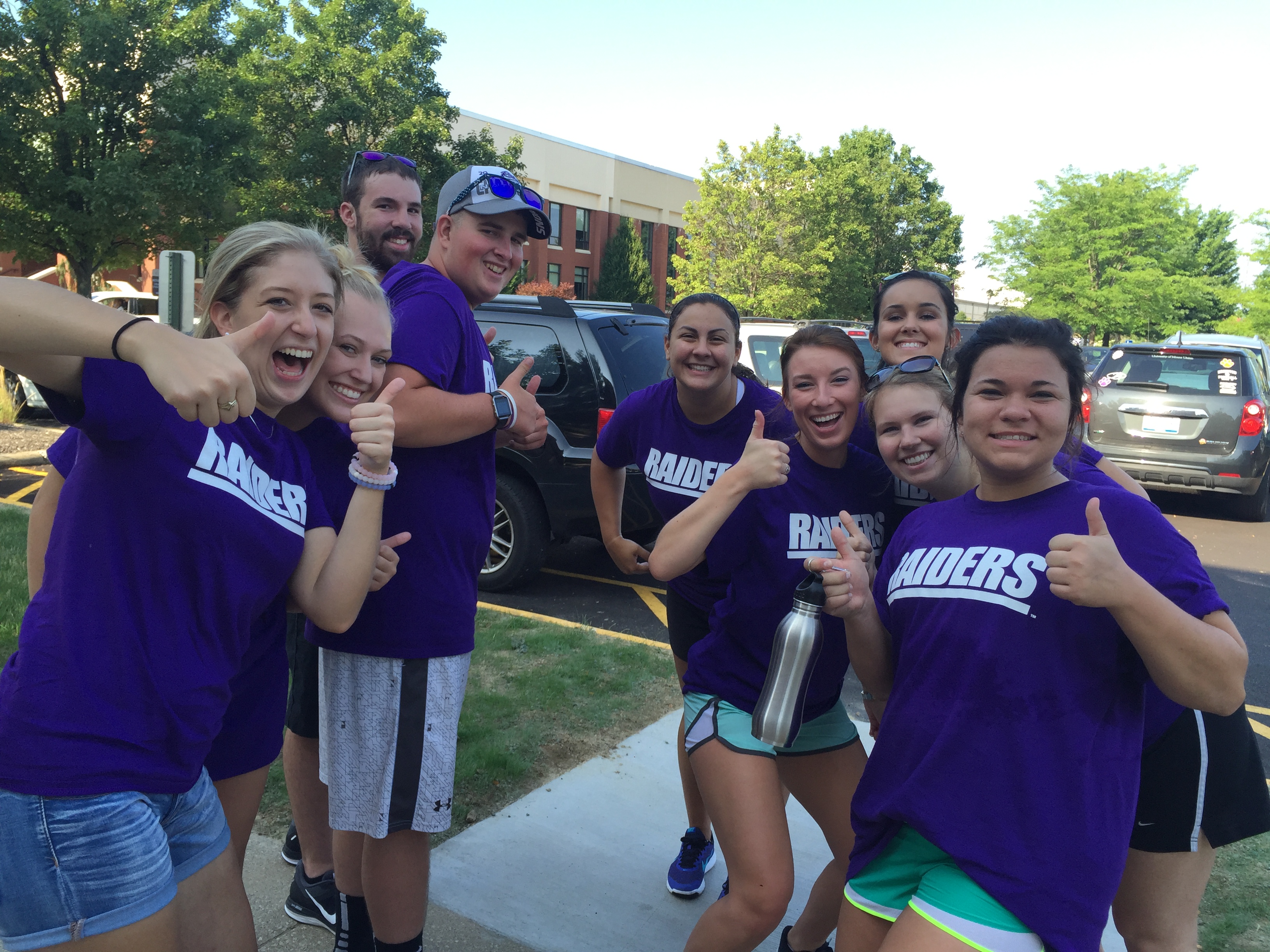 student group giving thumbs up