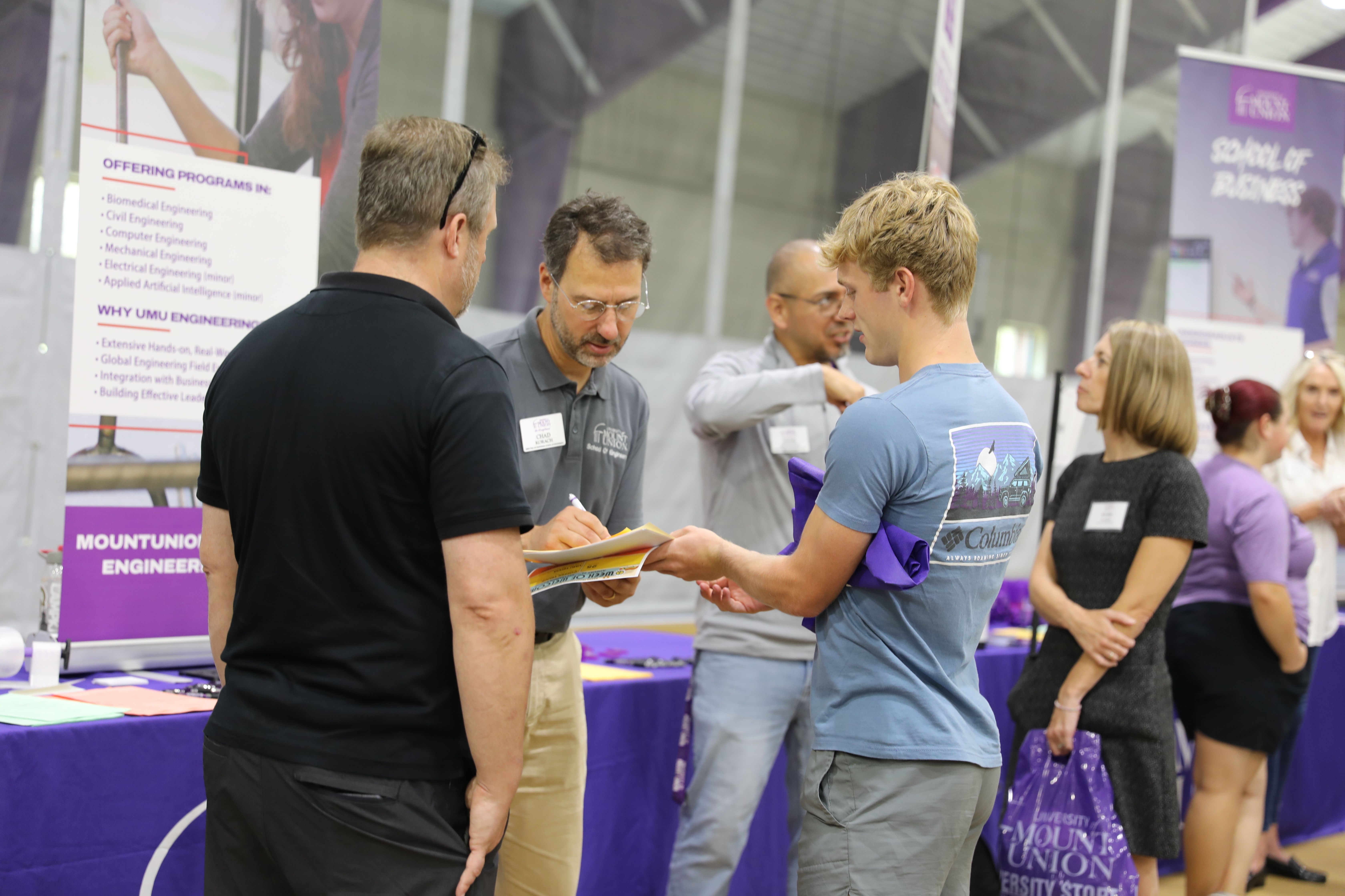 Faculty meeting with family at Preview