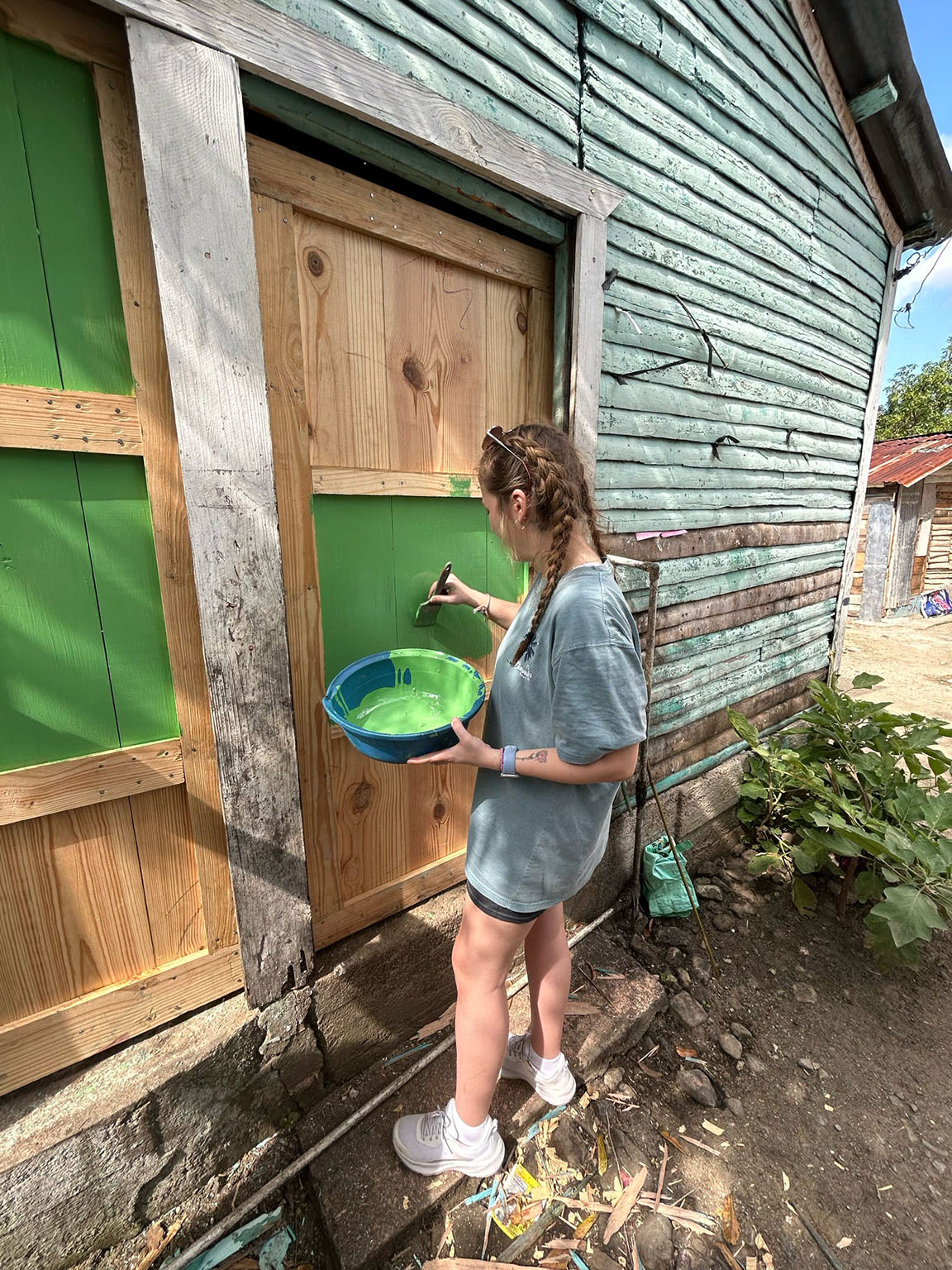 Dupont '24 painting a door