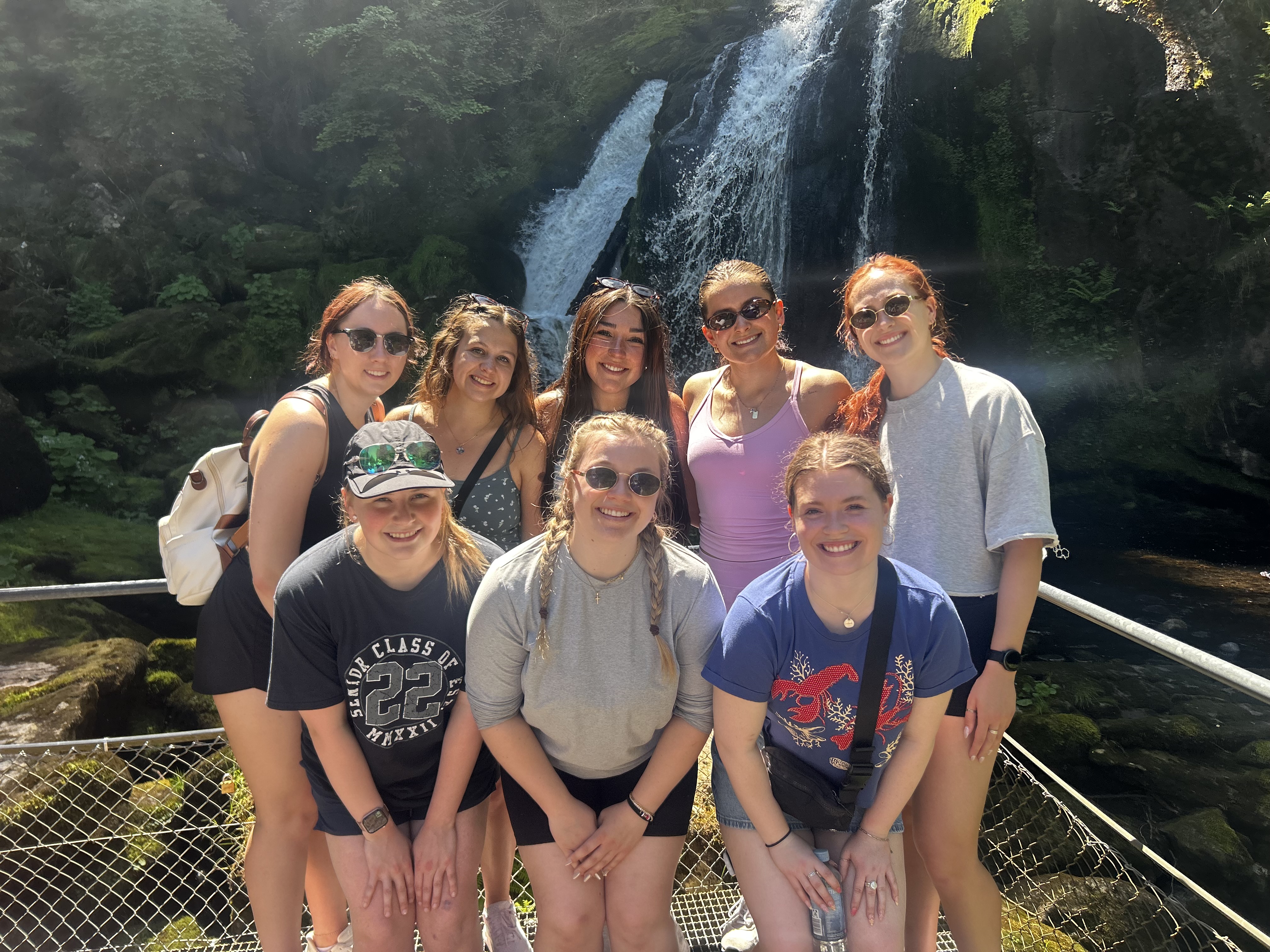 Students at a waterfall in Germany