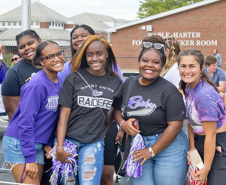 students in stands at game