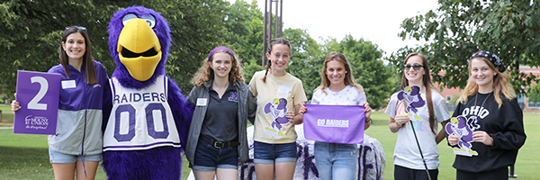 High school students posing during a campus tour.