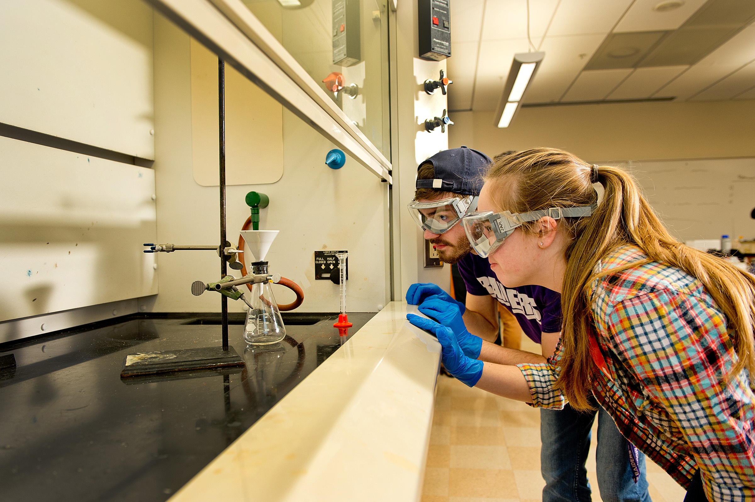 University of Mount Union chemistry students watching an experiment in the lab