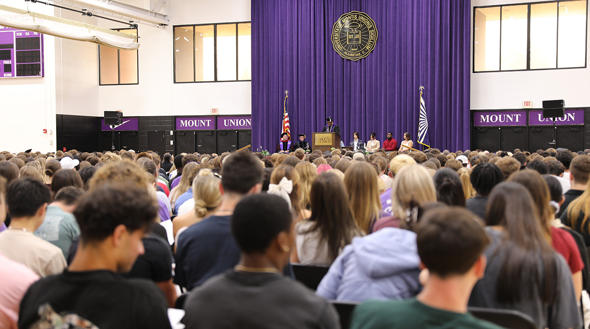 king speaking at podium in background
