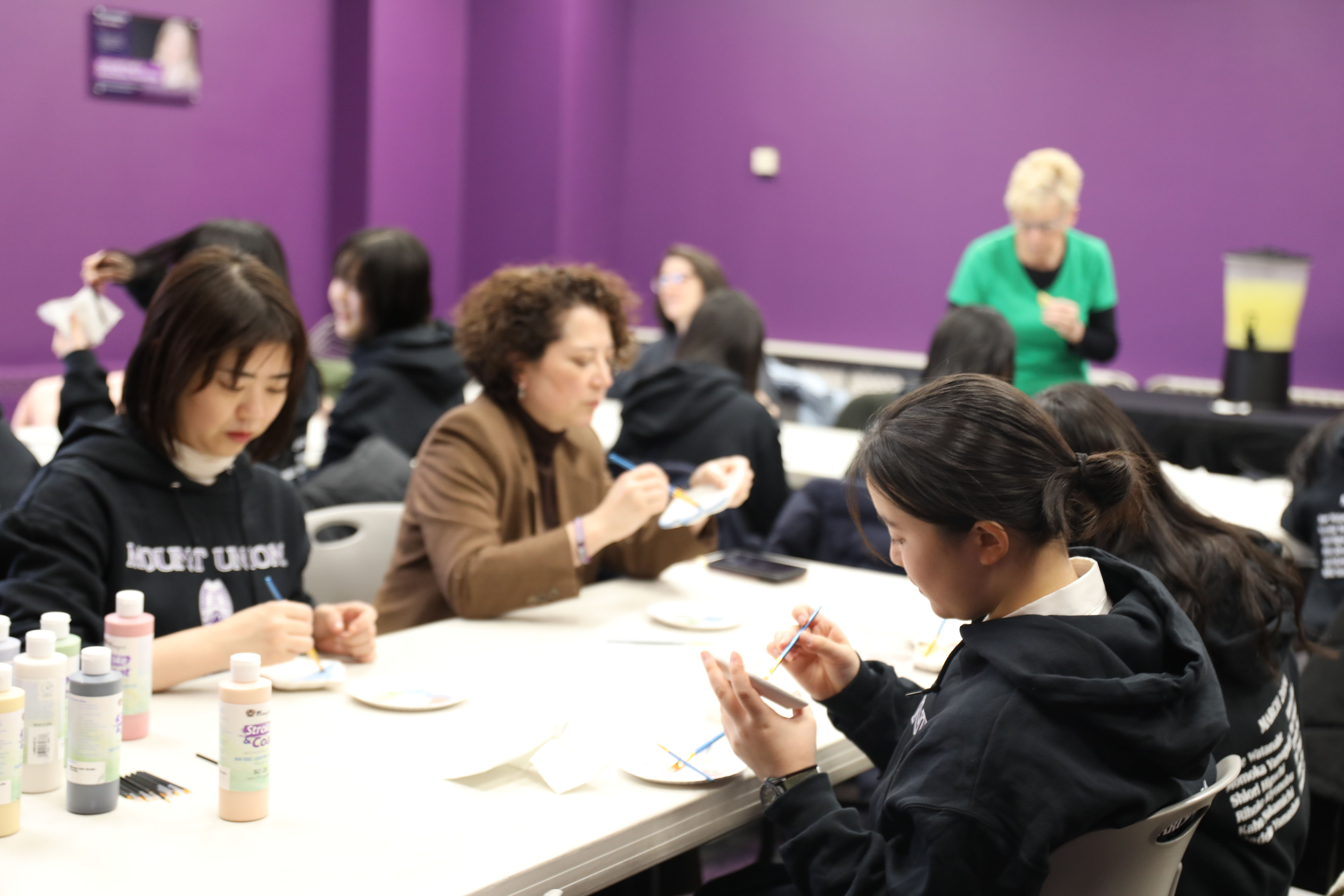 Hiroshima visiting students and professors painting Hot Pots