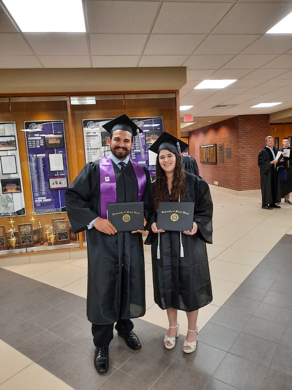 Betscakos '23 with a friend at graduation