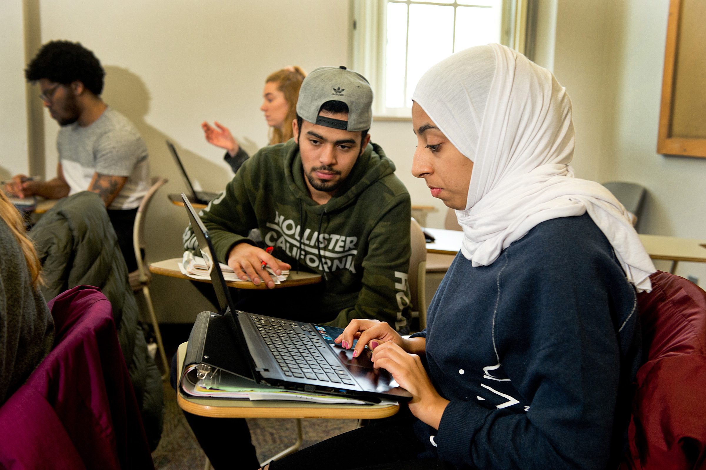 students sitting in class interacting