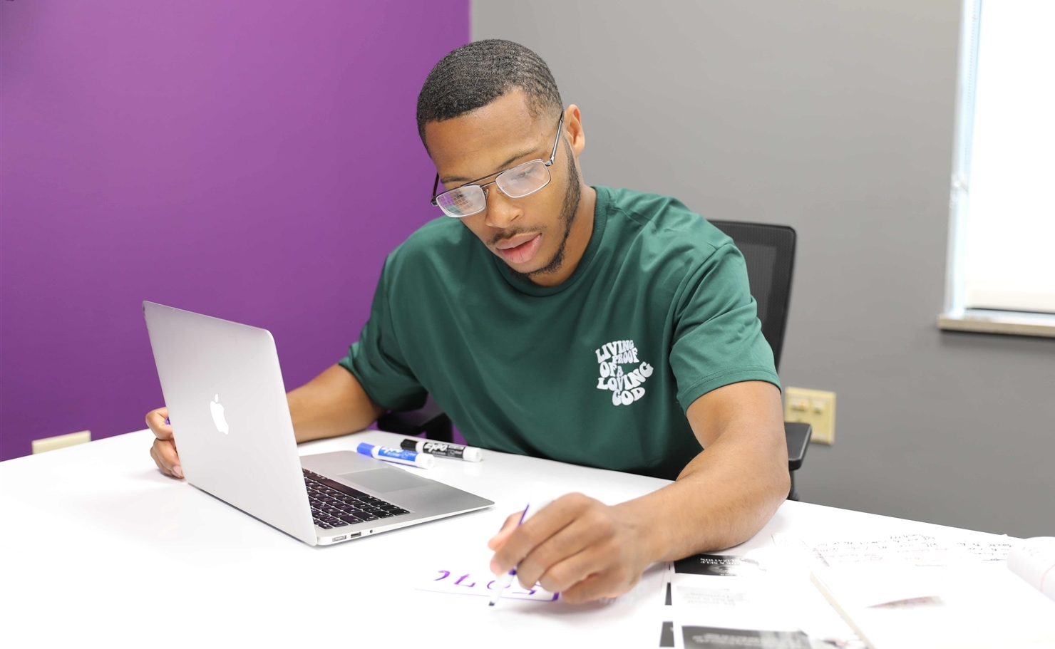 student taking notes