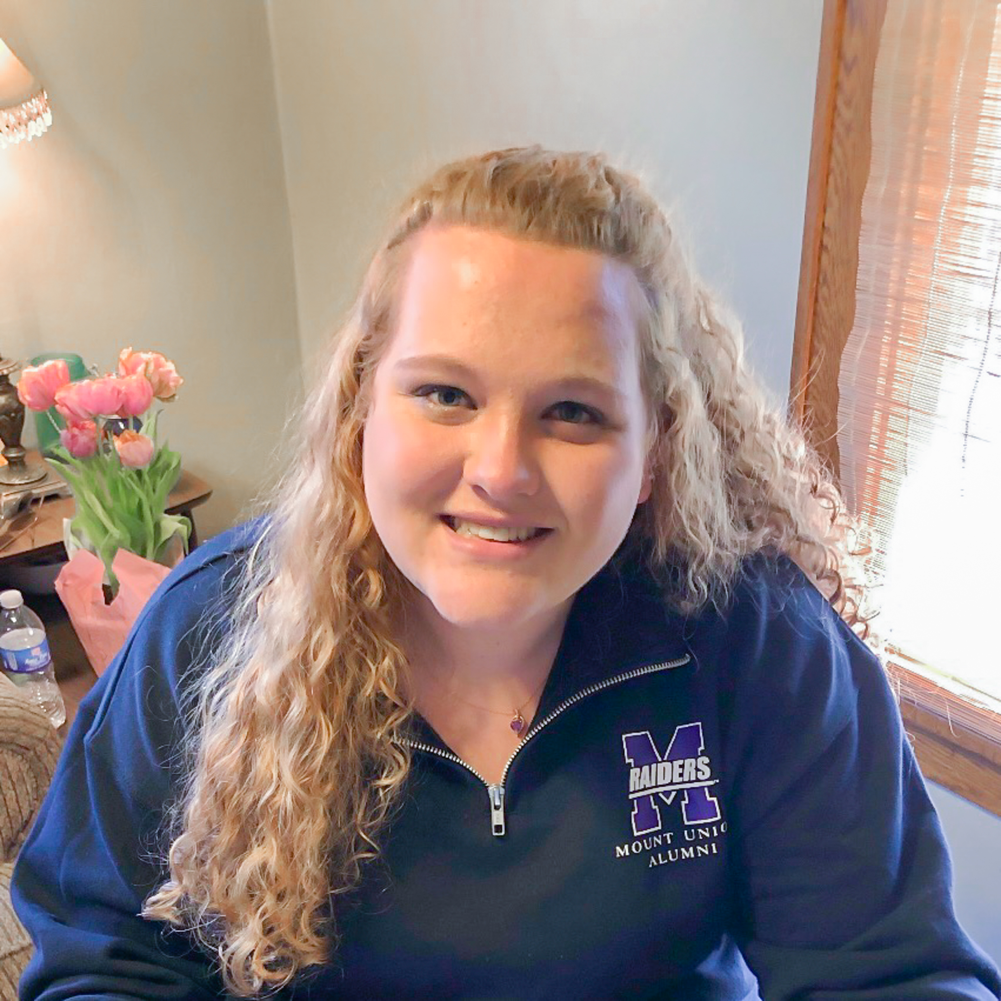 Molly McGinnis headshot sitting in her office