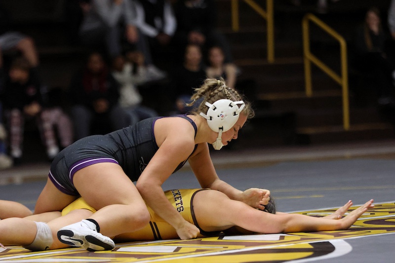 Stith '28 (top) at a wrestling match